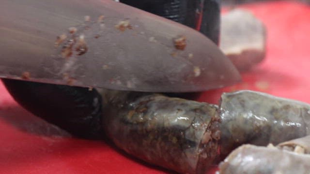 Steaming Sundae Being Cut on a Red Cutting Board