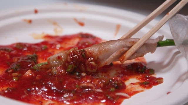 Dipping Grilled Thin-sliced Pork Belly and Asparagus in Sauce