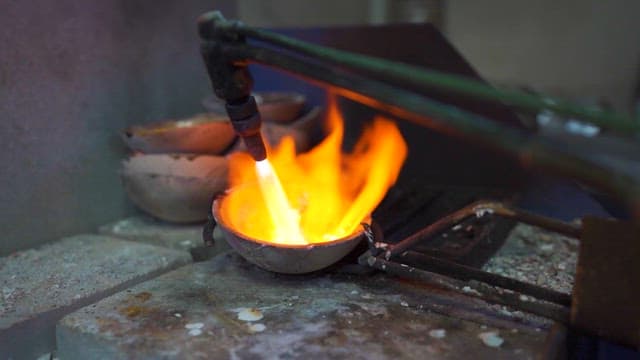 Artisan Heating Metal in a Forge