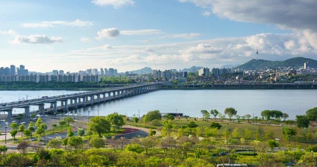 Panoramic view of the Han River and Seoul from daytime to evening