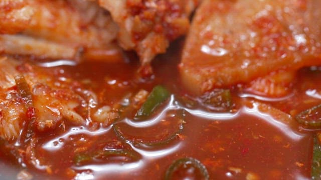 Chopstickful of deliciously cooked spicy braised hairtail