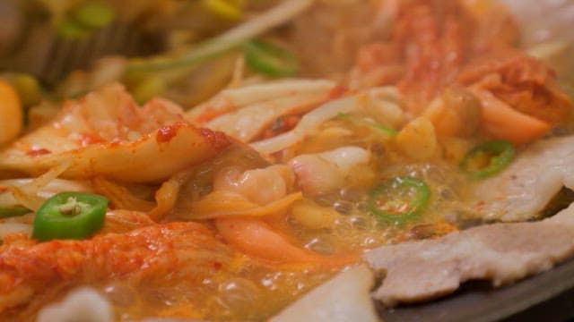 Spicy Korean Hot Pot with Kimchi Simmering Close-up