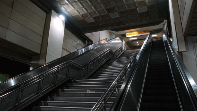 Empty Metro Station Escalators at Night