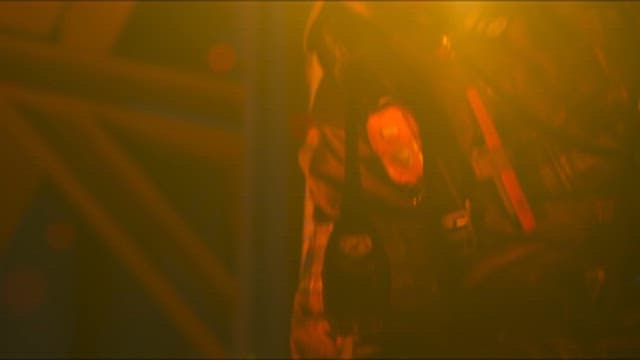 A firefighter extinguishing the flames in a burning building.