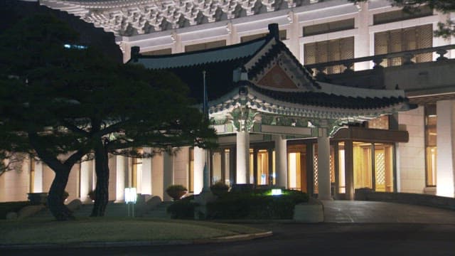 Illuminated Blue House at night