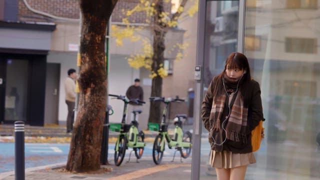 Student waiting at a bus stop