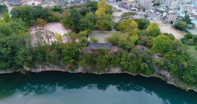 Traditional Korean Pavilion on a Cliff in Harmony with the City