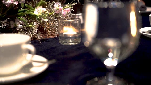 Elegantly Set Table with Candlelight and some glasses