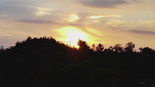 Serene Sunset Over Silhouetted Mountains
