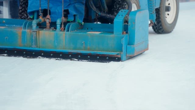 Ice resurfacing machine on a rink