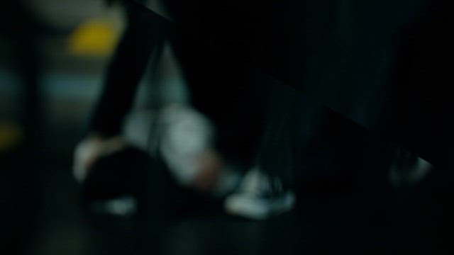 Man Waking up His Fallen Friend on Road at Night