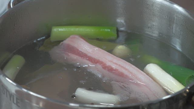 Boiled pork with various vegetables in a pot
