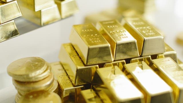 Pile of Gold Bars and Coins with Golden Sparkle