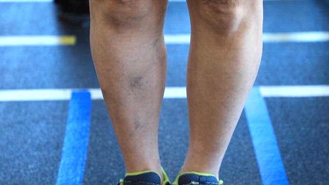 Legs of a Person Standing in the Gym