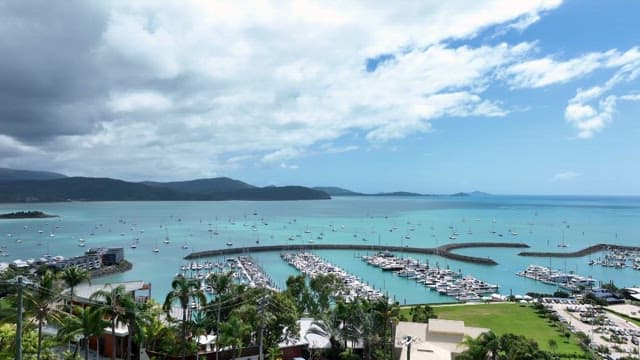 Marina with yachts and boats on a sunny day
