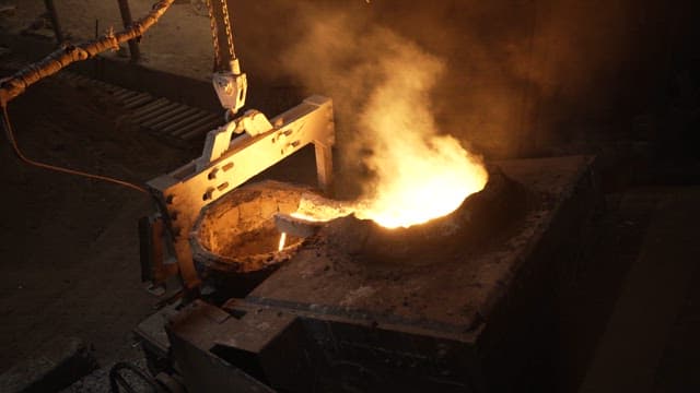Molten metal being poured in a foundry