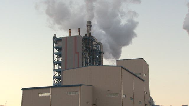 Industrial Plant Emitting Smoke at Dusk