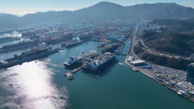 Aerial View of Busy Port and Urban Coastline