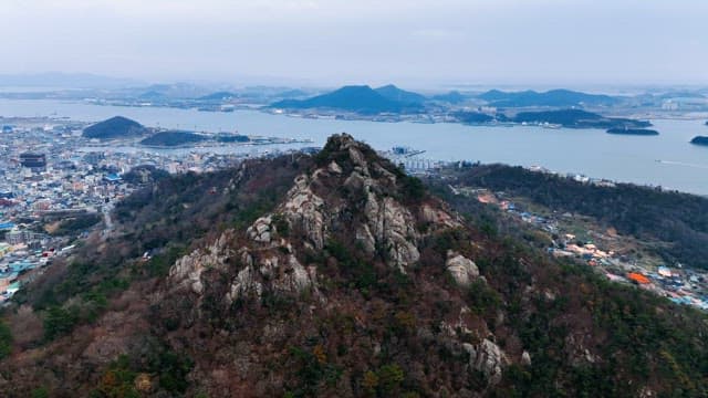 Mountain overlooking a coastal city