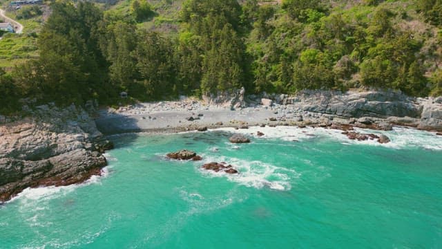 Rocky coastline with turquoise waves