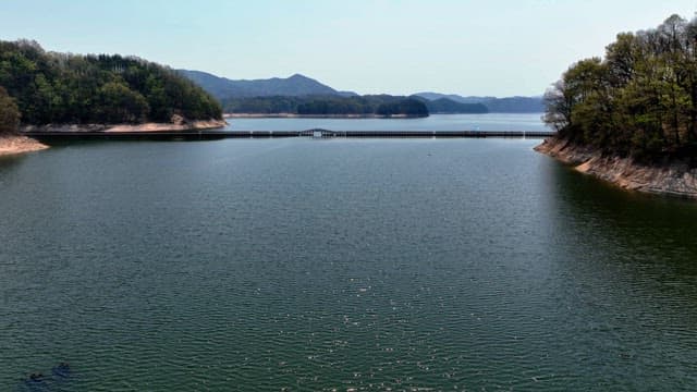 Tranquil lake with a wooden bridge