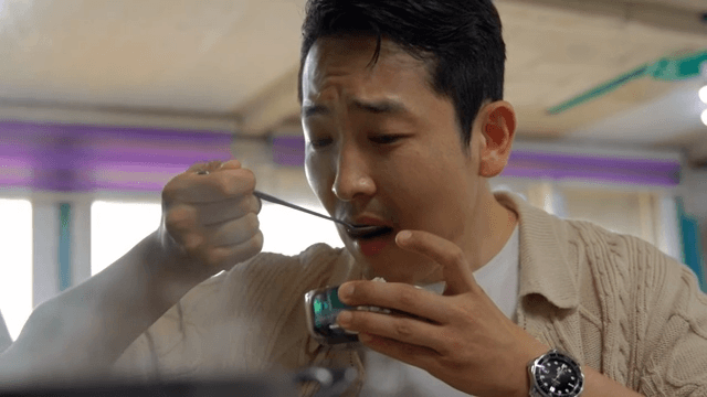 Man enjoying a hot meal indoors