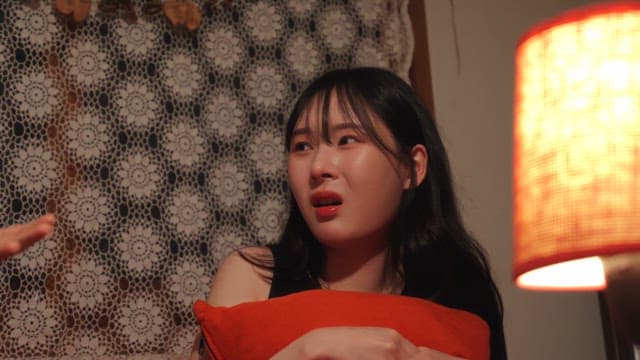 person listening to a story while holding a cushion