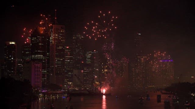 Fireworks display over a city skyline