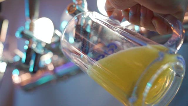 Pouring Fresh Beer into a Glass
