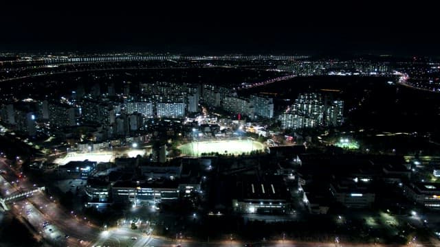 Night View Illuminated by the Lights of Buildings and Traffic in a Bustling City