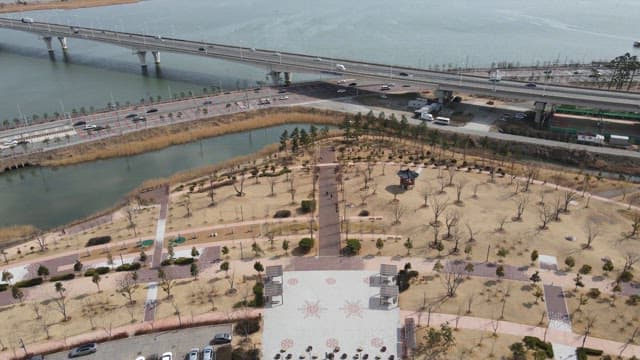Park near a bridge with a river view