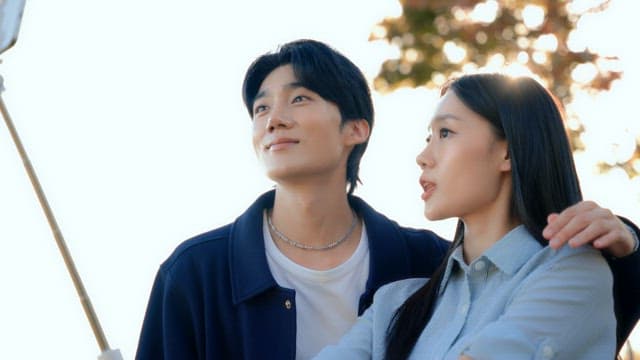 Couple taking selfies in a park