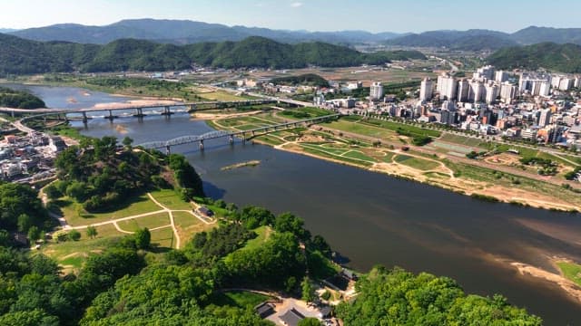 Tranquil river with a city in the background