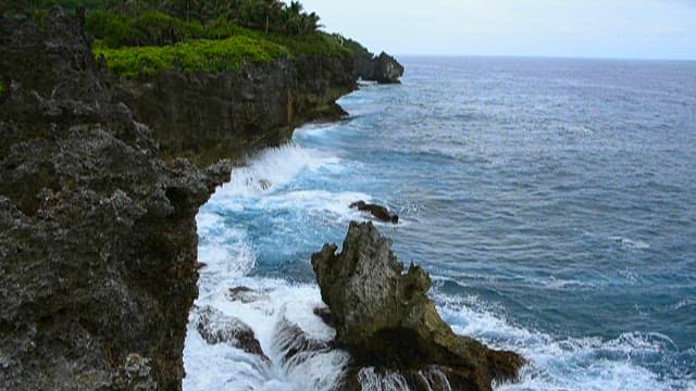 Rugged cliffs with waves crashing ashore