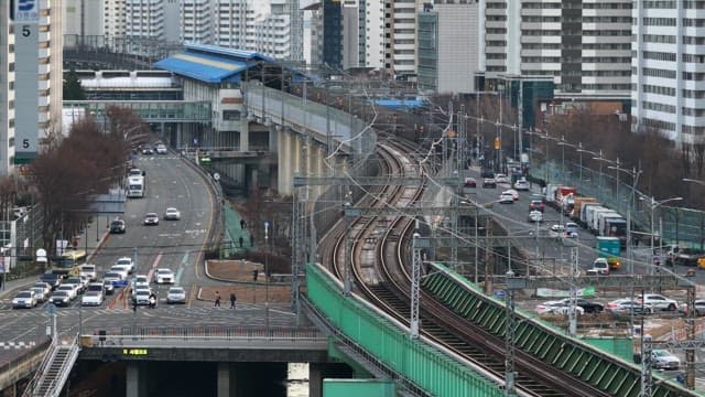 Subway Passing over a Bridge over a Busy City