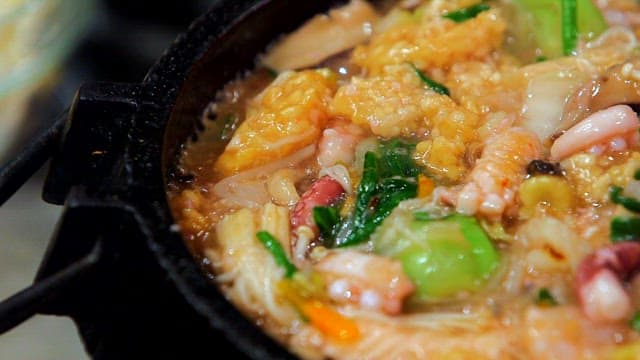 Seafood Scorched Rice Soup Cooked in a Hot Pan