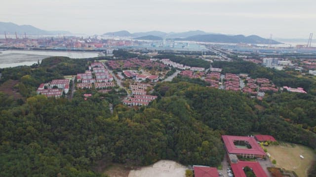 Coastal town with residential buildings and greenery