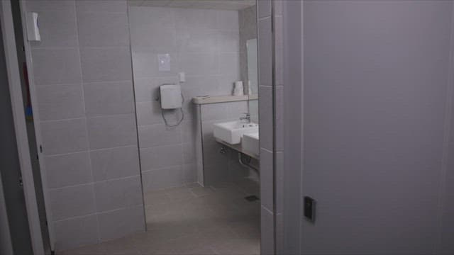 Woman coming out of the toilet with a depressed expression