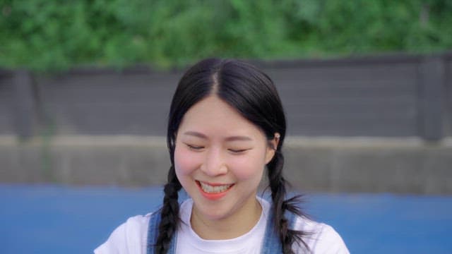 Woman throwing a basketball upward