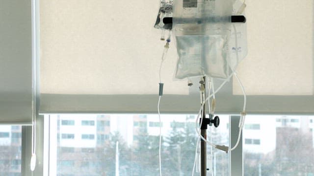 IV drip in a sunlit hospital room