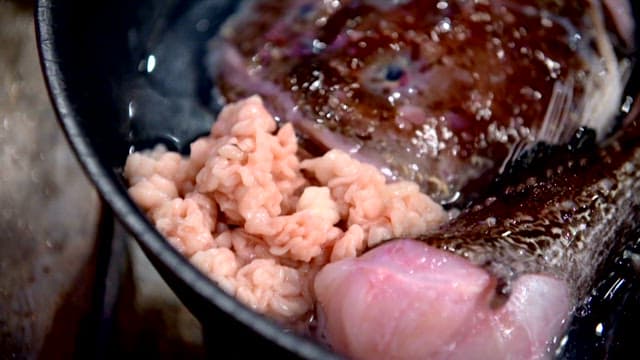 Ingredients for shaggy sea raven stew in a pot
