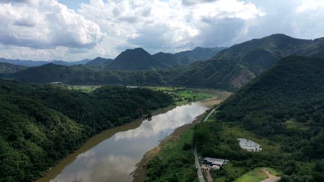 Serene River Winding Through a Mountainous Landscape
