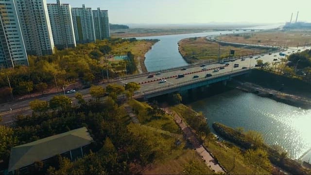 Quiet Stream Along the City with a Bridge