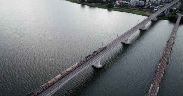 Subway crossing a bridge over a river