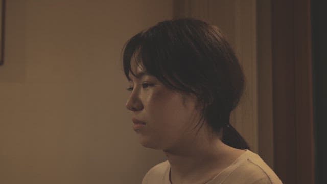 Woman crying with a scar on her face