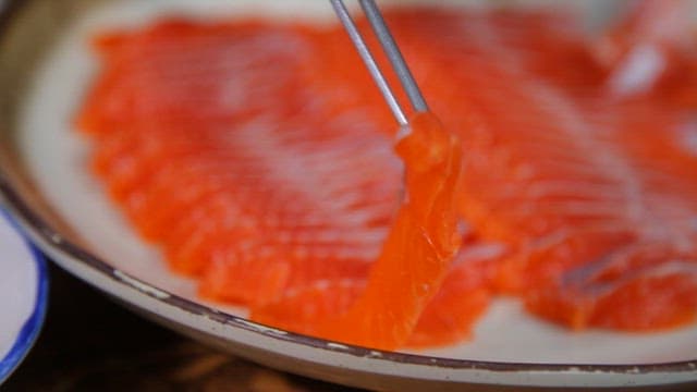 Freshly sliced trout sashimi on a plate