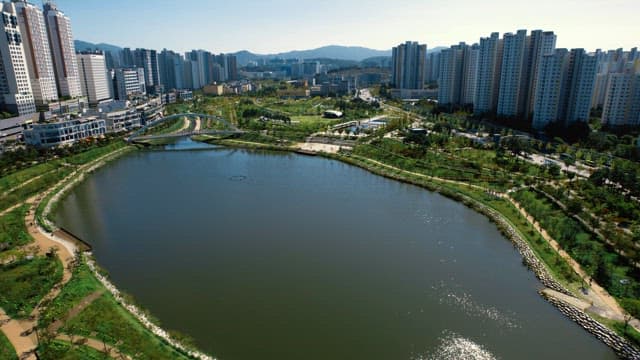 Cityscape with apartments and lake park