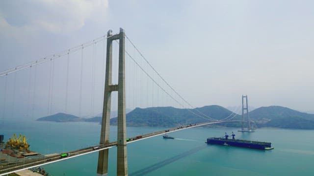 Large suspension bridge over calm sea