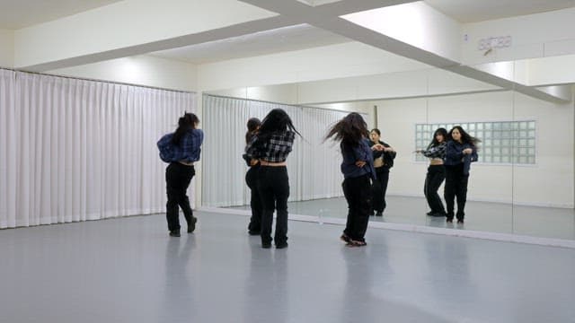 K-POP Dancers Practicing in a Studio