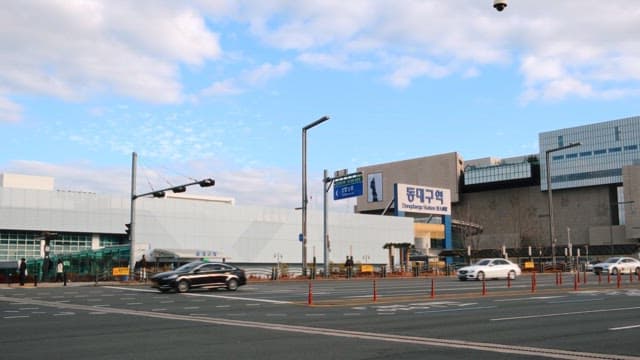 City intersection in front of modern station